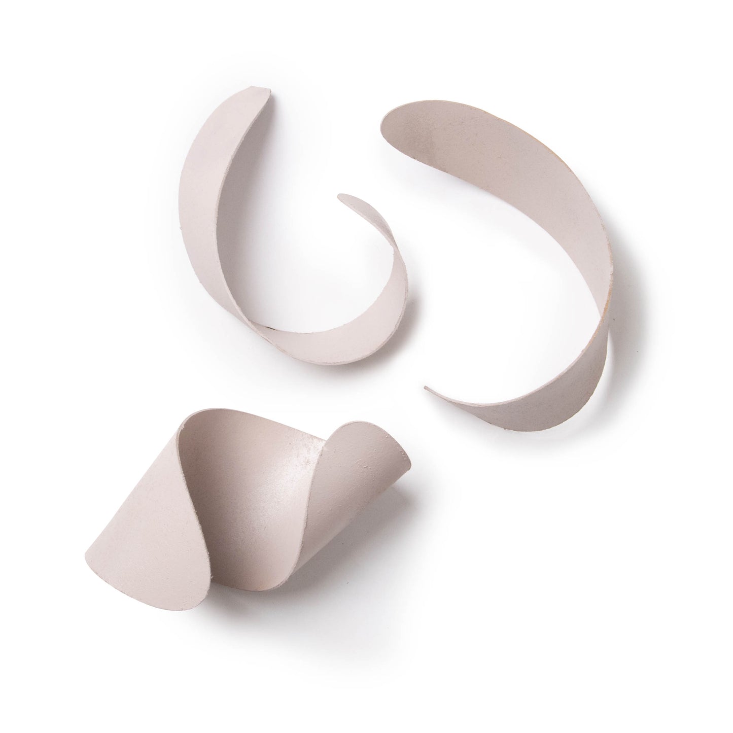 A set of three curved photography and videography props